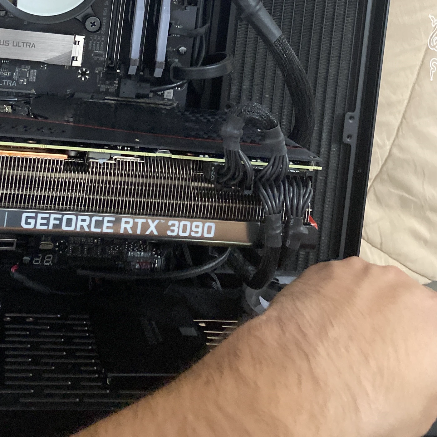 Technician installing a high-end graphics card into a custom PC build